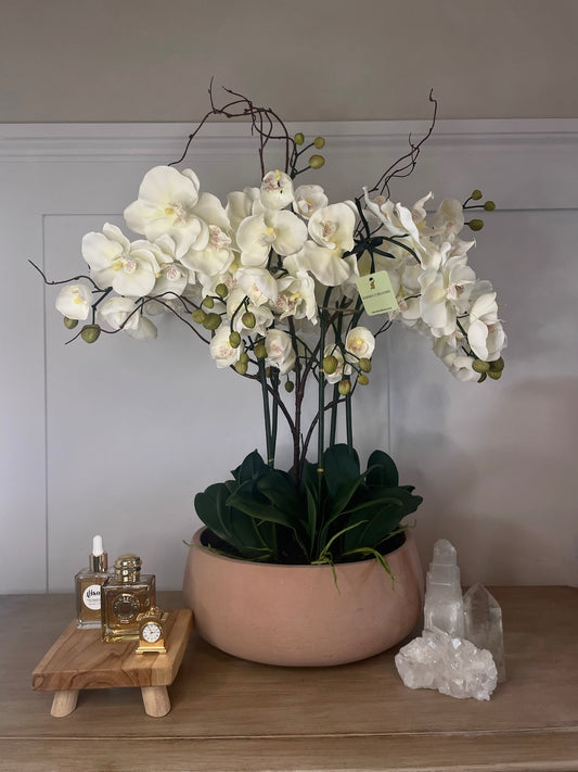  Halo Noir Orchid bespoke faux orchid arrangement with black tourmaline crystal bed styled in a dramatic luxury interior setting