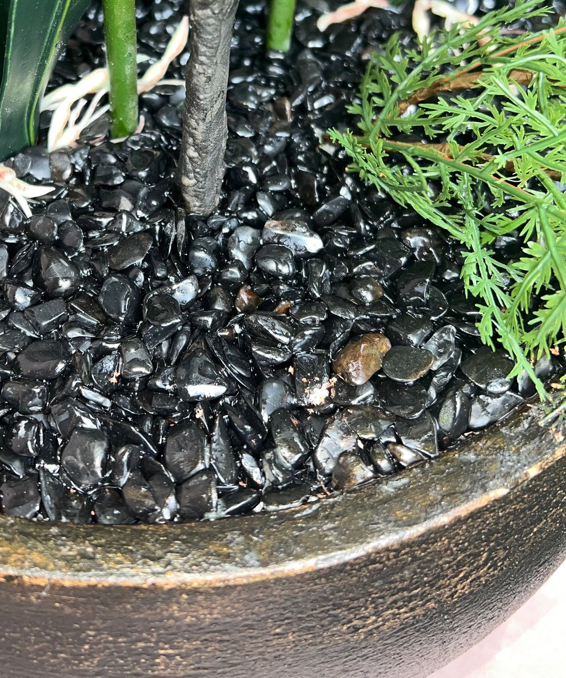 Kensington Noir Orchid close up of genuine black tourmaline crystal bed resin-set to a high gloss finish