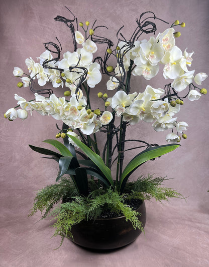 Kensington Noir Orchid bespoke faux orchid arrangement with black tourmaline crystal bed styled in a dramatic luxury interior setting