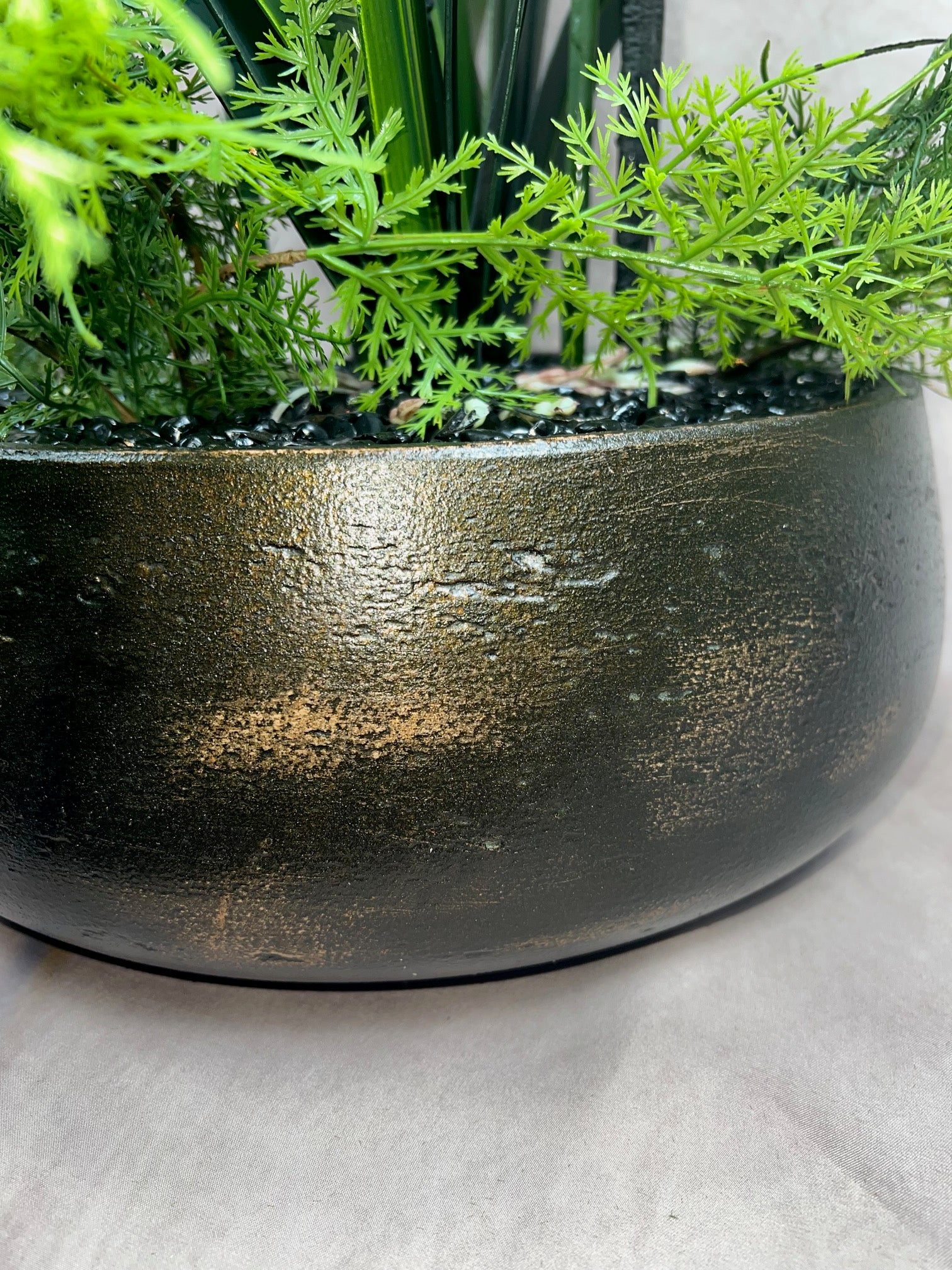 Kensington Noir Orchid close up of dark bronze planter with genuine copper leaf finish and soft orchid foliage